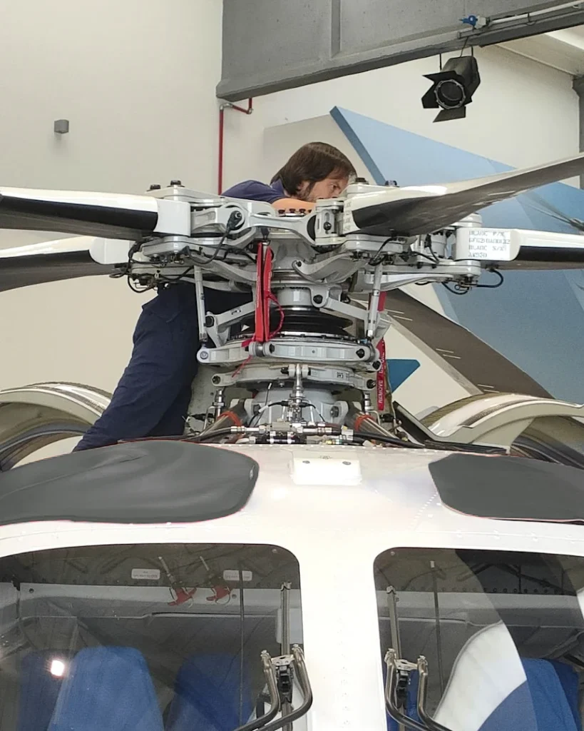 HSC CAMO Engineer working on Helicopter during an Inspection